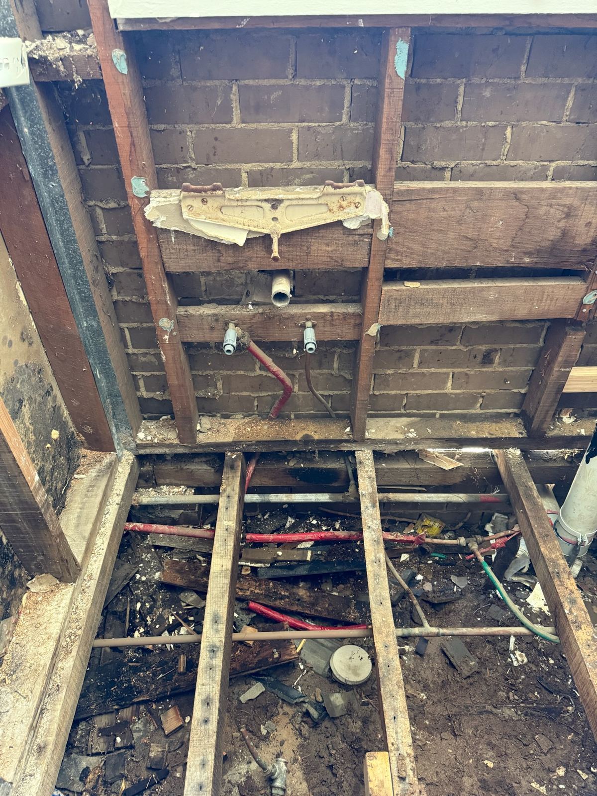 Bathroom pipework exposed for repair
